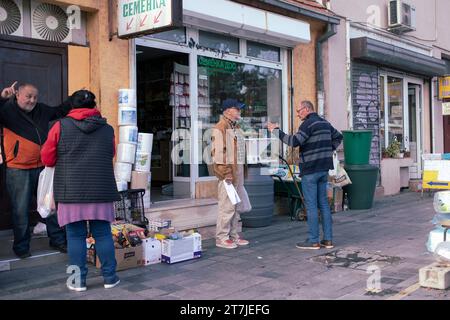 Belgrade, Serbia, Nov 7, 2023: Locals meet and chat at the marketplace in Zemun Stock Photo