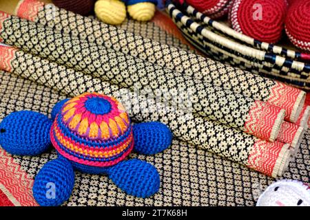 Woolen art in handcraft, Multicolored knitted handmade children toys. Stock Photo