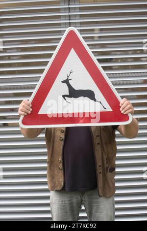 Attention animal crossing traffic or road sign, red triangle as warning notice Attention animal crossing traffic or road sign Credit: Imago/Alamy Live News Stock Photo