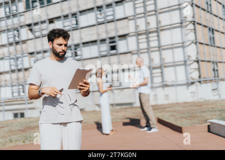 Successful Architects Collaborating on a Modern Urban Construction Project Stock Photo
