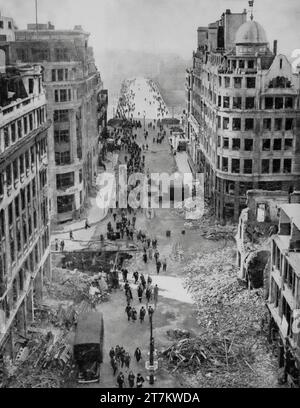 The view of a rubble strewn street leading to London Bridge on the morning after an overnight air raid during the Second World War by the Luftwaffe in the city in September 1940. Stock Photo