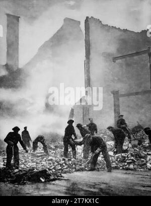 Members of the Pioneer Corps clearing rubble and damage to London streets following Luftwaffe air raids during the Second World War in January 1941. Stock Photo