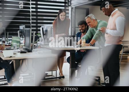 Multiracial Business Team Collaborating on Strategic Planning and Market Research in Corporate Office Stock Photo