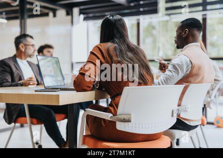 Multiracial Business Team Collaborating on Market Analysis and Strategic Planning in Corporate Office Stock Photo