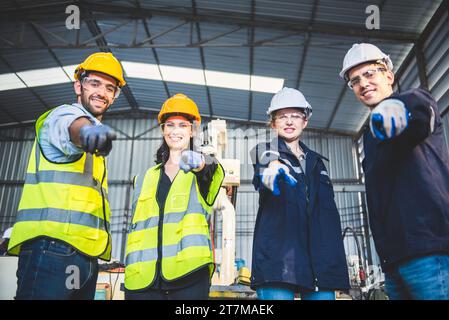 Engineers team mechanic standing in steel factory workshop. Industry robot programming software for automated manufacturing technology Stock Photo
