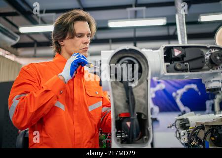 Maintenance engineering repair automatic welding robotic arm machine at production line in the industry factory. Stock Photo