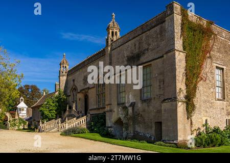 Autumn sunlight on the west front at Lacock Abbey, Wiltshire, England, UKat Lacock Abbey, Wiltshire, England, UK Stock Photo