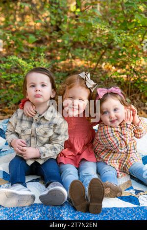 Brother and sister hugging in forest Stock Photo - Alamy