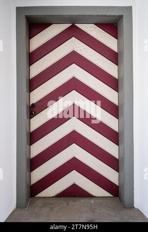 Red and white striped door in a historic building in the Old Town of Wangen im Allgäu, Baden-Württemberg, Germany. Stock Photo