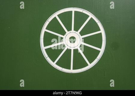 Historic wheel symbol, Inn to the Wheel (Gasthaus Zum Rad), 16th century building in the Old Town of Wangen im Allgäu, Baden-Württemberg, Germany. Stock Photo