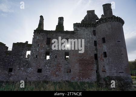 Sun shining through window of the ruined Caerlaverock Castle under blue sky, Dumfries and Galloway, Scotland Stock Photo