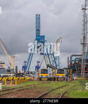Scrap class 321 electric multiple unit trains waiting to be broken up and recycled at SIMS metals, Newport docks, South Wales, UK Stock Photo