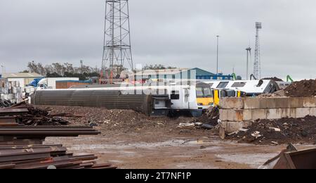 Scrap class 321 electric multiple unit trains waiting to be broken up and recycled at SIMS metals, Newport docks, South Wales, UK Stock Photo