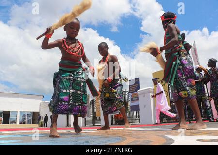 Children in front of the monarch's palace during the Olojo Festival celebration at Ile-Ife, in Osun state. The Olojo festival is a celebration of Ogun, god of Iron, it commemorates the descent of Oduduwa to Ile-Ife, the celebration of the first dawn, the first afternoon, and the first night of creation. Olojo festival is one of the oldest in Africa, celebrated all over Yoruba land. It celebrates the dawn of the first day of existence on Earth, where the monarch wears the sacred crown that holds greater significance in the Olojo celebration, Nigeria. Stock Photo