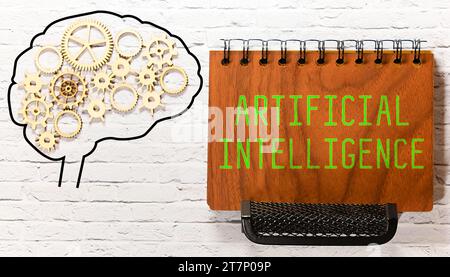 AI text with a person holding a pen on a wooden desk. Stock Photo