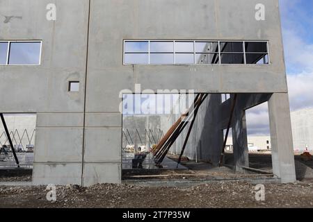 The interior and exterior of a concrete tilt up warehouse under construction. Stock Photo