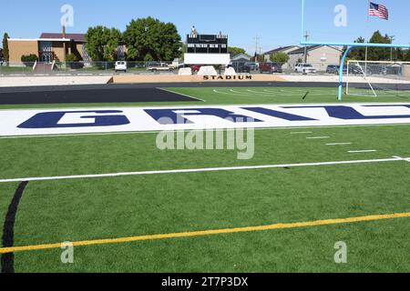 Newly installed green artificial or Astro Turf installed on a high school football field. Stock Photo