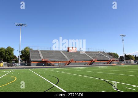 Newly installed green artificial or Astro Turf installed on a high school football field. Stock Photo