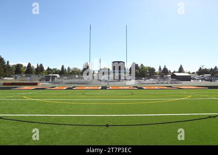 Newly installed green artificial or Astro Turf installed on a high school football field. Stock Photo