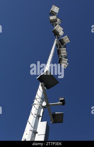 Modern energy saving LED light on top of high poles, to illuminate a high school football field. Stock Photo