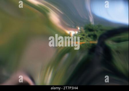 Abstract of White Building in Center of Swirled Colorful Landscape Stock Photo