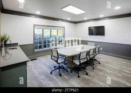 An interior view of a small corporate conference room with furniture Stock Photo