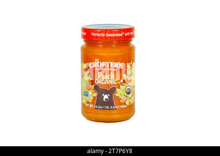 A jar of Crofter's Peach Organic Premium Spread isolated on a white background. cutout image for illustration and editorial use. Stock Photo