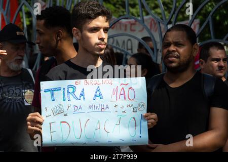 Salvador, Bahia, Brazil - May 30, 2019: Brazilians are seen holding signs and protesting against cuts to education by President Jair Bolsonaro in the Stock Photo