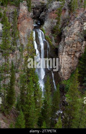 Cascade Creek plunges 129 feet at Crystal Falls before reaching the Yellowstone River between the Upper and Lower Falls along the Grand Canyon of the Stock Photo