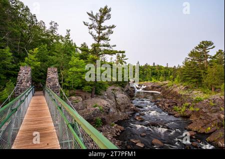 Swinging Bridge Over St. Louis River in Jay Cooke State Park in Minnesota Stock Photo