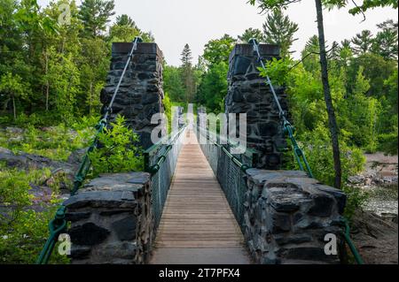 Swinging Bridge Over St. Louis River in Jay Cooke State Park in Minnesota Stock Photo