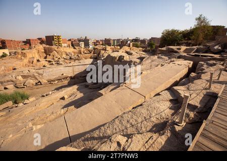 Giant unfinished obelisk being carved out of stone in ancient Egyptian quarry Stock Photo