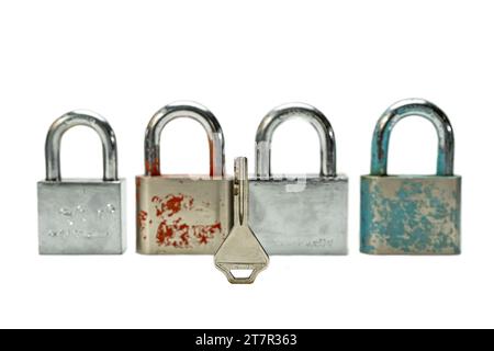 4 padlocks and 1 key isolated on a white background. Stock Photo