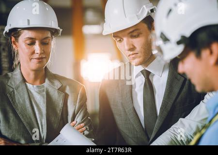 closeup business investor team meeting with engineer discussion brainstorming project planning at construction site. Stock Photo