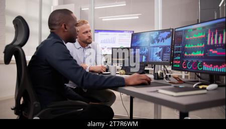 African American Data Analyst Using Data Analytics KPI Dashboard Stock Photo