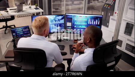 African American Data Analyst Using Data Analytics KPI Dashboard Stock Photo