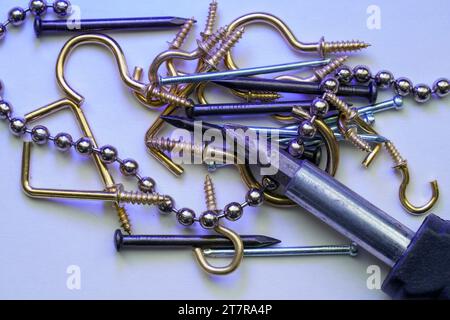 A colorful mix of nails and screws with eyelets and hoes Stock Photo