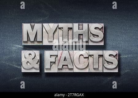 myths and facts phrase made from metallic letterpress on dark jeans background Stock Photo