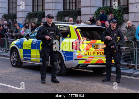 Authorised Firearms Officers on duty on Armistice Day in the City of London before the Lord Mayor's Show parade. Public gathering for outdoor event Stock Photo
