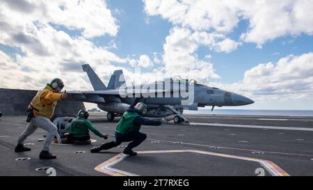 USS Ronald Reagan (CVN 76) conducts routine flight operations in the Philippine Sea on Nov. 14, 2023. Photo by Charlotte Dudenhoeffer Stock Photo