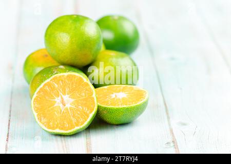 fresh citrus fruits on wooden table Stock Photo