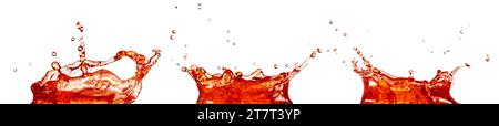 Crown shaped splashes of bright red transparent liquid isolated on white background. Real shot. Stock Photo