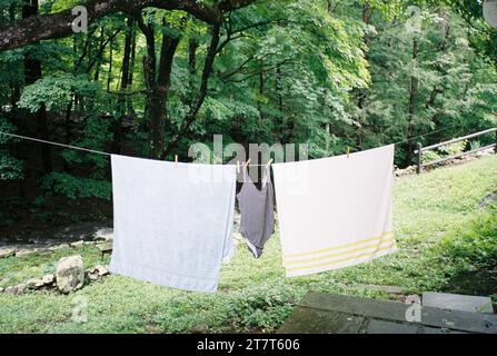 Vintage-style 35mm film photo of laundry and beachwear drying on Stock Photo