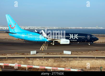 A Boeing 737-800 of TUI's German TUI fly division in a special TUI Blue hotels livery waiting to depart Lanzarote Arrecife Airport Stock Photo