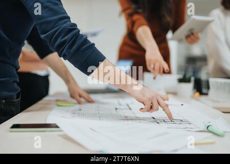 Successful Multiracial Corporate Team Analyzing Reports for Business Growth Stock Photo