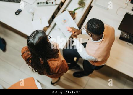 Creative Office. Business Team Analyzing Reports for Financial Planning and Business Growth. Stock Photo