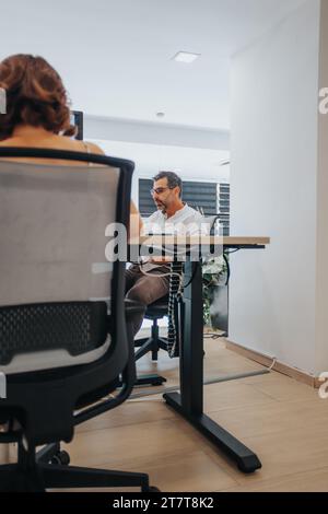 Confident Business Partners Analyzing Reports for Future Success Stock Photo