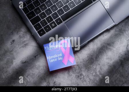 top view of pink brassiere on light pink background, breast cancer concept  Stock Photo by LightFieldStudios