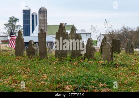 View of an Old Cemetery, with Very Old Headstones, in the Middle of the Countryside, Near a Farm, on a Fall Day Stock Photo