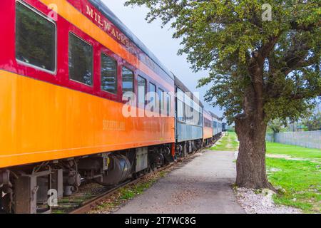 Vintage rail cars, many from 1920s, in the Austin Steam Train Association Train Yard at Cedar Park, Austin. Cars in active use have been renovated. Stock Photo